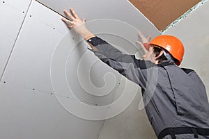 Man installing drywall