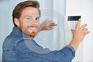 man installing ip wireless cctv camera