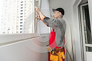 Man Installing New Windows In House. High quality photo