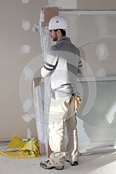 Man installing plaster divide