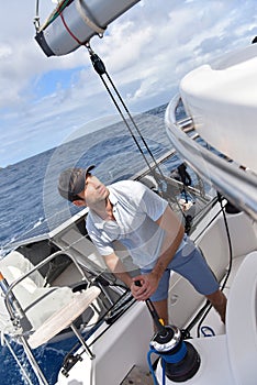 Man installing sails for navigation