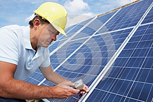 Man installing solar panels