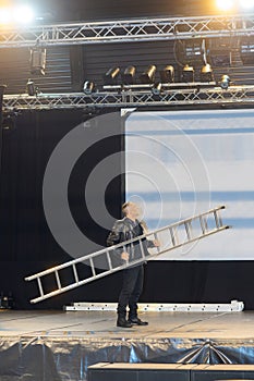 Man installing stage at musical event