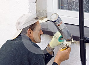 Man installing windowsill #4 photo