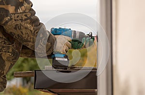 The man insulates the house with foam blocks