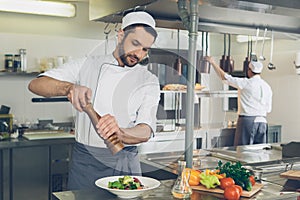 Man japanese restaurant chef cooking in the kitchen