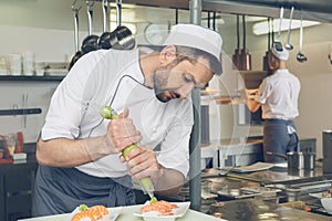 Man japanese restaurant chef cooking in the kitchen