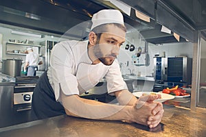 Man japanese restaurant chef cooking in the kitchen