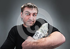 Man with jar of dollars