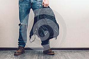 Man in jeans with backpack photo