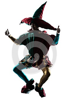 Man in jester costume silhouette jumping