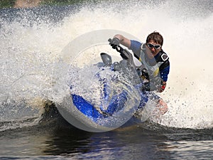 Man on jet-ski turns very fast with diving