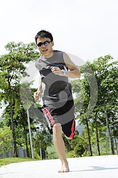 Man jogging barefoot