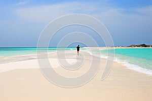 Man jogging on the beach