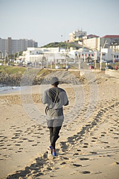 Man Jogging on Beach
