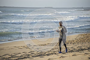 Man jogging on beach in early morning