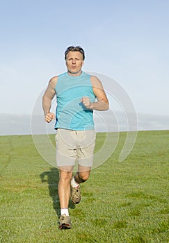 Man jogging in blue shirt