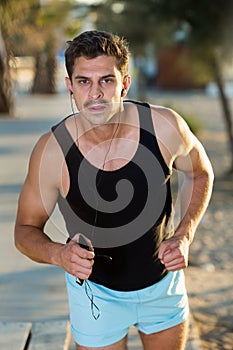 Man jogging on city seafront