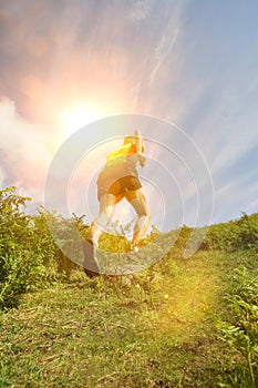 Man jogging in countryside, backview