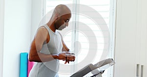 Man jogging on treadmill 4k