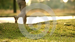 A man jogs early in the morning after the sun began to dry residual water after the rain