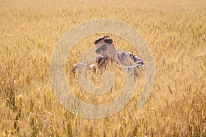 Man joking surrounded by a wheat field