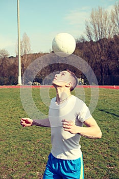 Man juggles with his head photo