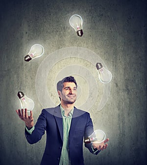 Man juggling with light bulbs