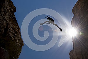 Man Jump through the Gap in the Mountain