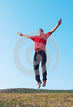 Man jump from ground above blue sky, freedom life