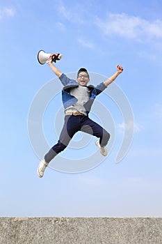 Man jump and shout megaphone