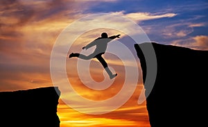 Man jumping across the gap