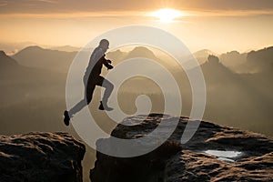 Man jumping against sky during sunset. Pure excitment photo