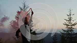 Man jumping in air with smoke grenade in hand. Excited guy enjoying success