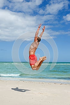 Man jumping on the beach