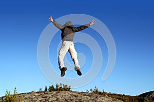 Man jumping from a cliff