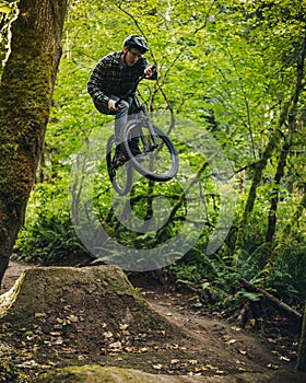 Man Jumping at Duthie Hill Mountain Bike Park in Washington State