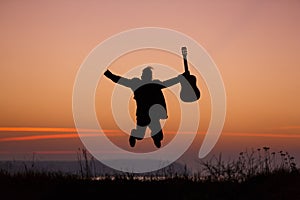 Man jumping with guitar