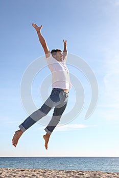 Man jumping happy in the beach