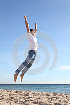 Man jumping happy in the beach