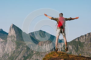 Man jumping on mountain cliff travel active healthy lifestyle outdoor