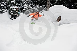 Man jumping from a mountain hill down