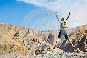 Man jumping on the mountain top