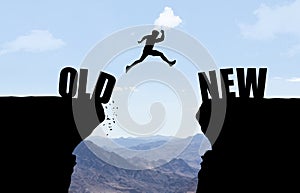 Man jumping over abyss with text OLD/NEW.