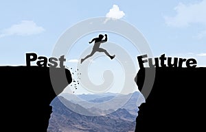 Man jumping over abyss with text Past/Future. photo