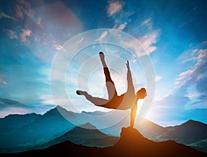 Man jumping over rocks in parkour action in mountains.