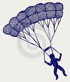 Man jumping with parachute