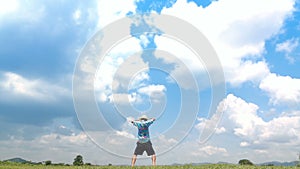 A man jumping slow motion and cloud sky background.