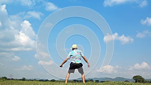 A man jumping slow motion and cloud sky background.