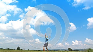 A man jumping slow motion and cloud sky background.